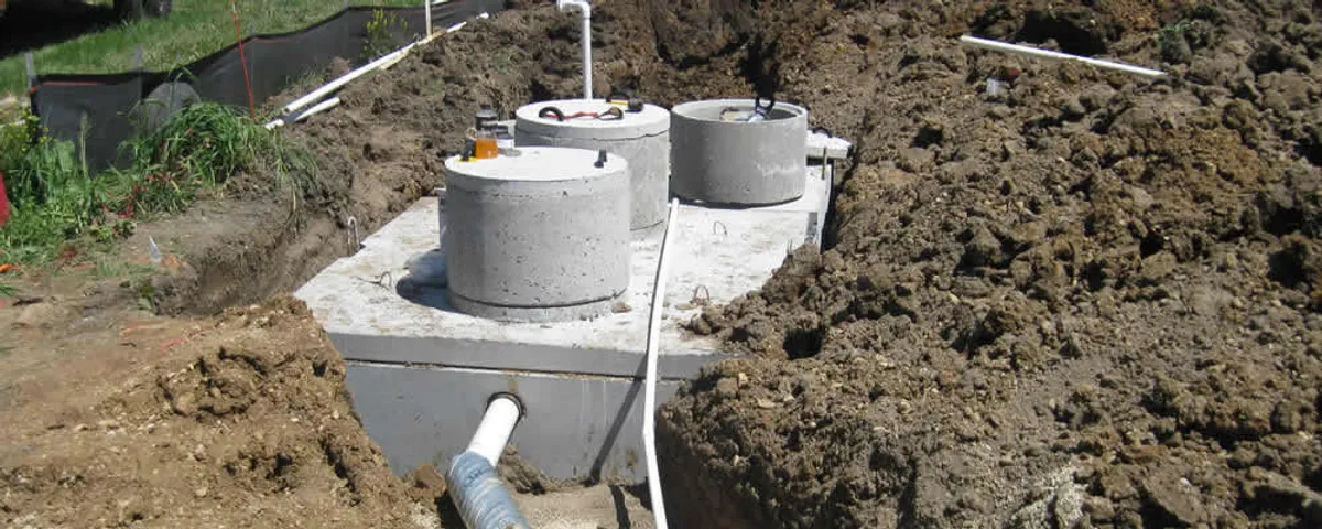Septic system repair and installation site with tank access ports in Savannah, GA